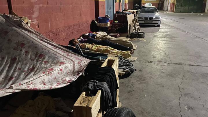 Migrants sleep in the Tarajal industrial zone in Ceuta on August 17, 2026