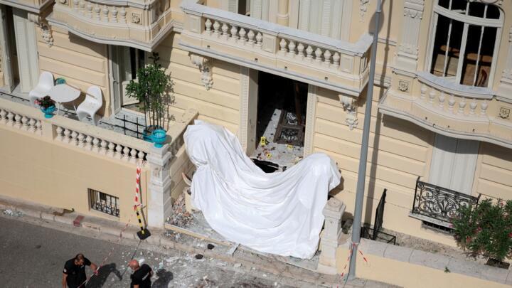 Members of a bomb disposal team operate the day after an attack involving an explosive device in the lobby of a residential building, in Monaco.