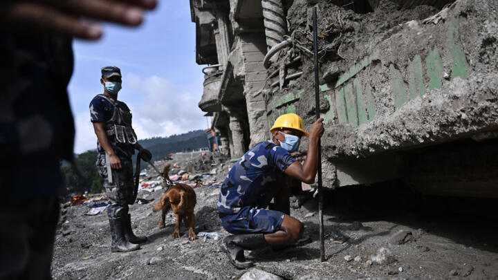 Police rescue workers search for survivors in the aftermath of flash floods at Trishuli in Nepal's Nuwakot district on September 7, 2026