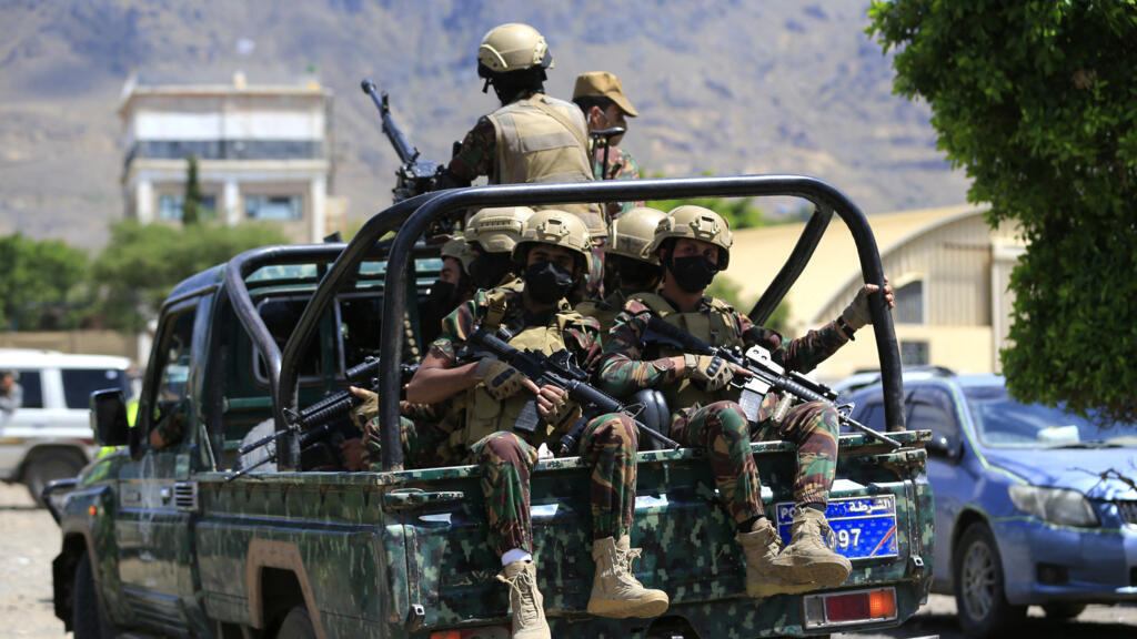 Yemen's Houthi armed forces patrol as Yemeni prisoners loyal to the Houthi authorities arrive in the capital Sanaa on September 12, 2026