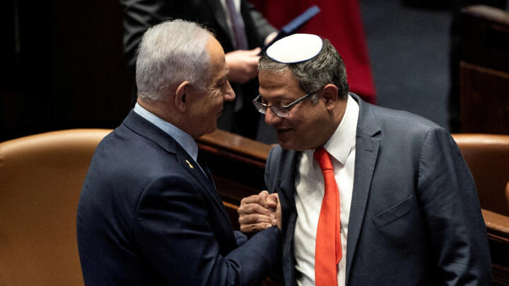 A file photo showing Israeli Prime Minister Benjamin Netanyahu and Itamar Ben-Gvir shaking hands in the Knesset in Jerusalem.