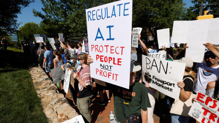 A demonstrator holds a sign calling for regulation of artificial intelligence during a protest outside the G20 Innovation Ministerial summit, in Chapel Hill, North Carolina, U.S., September 2, 2026.