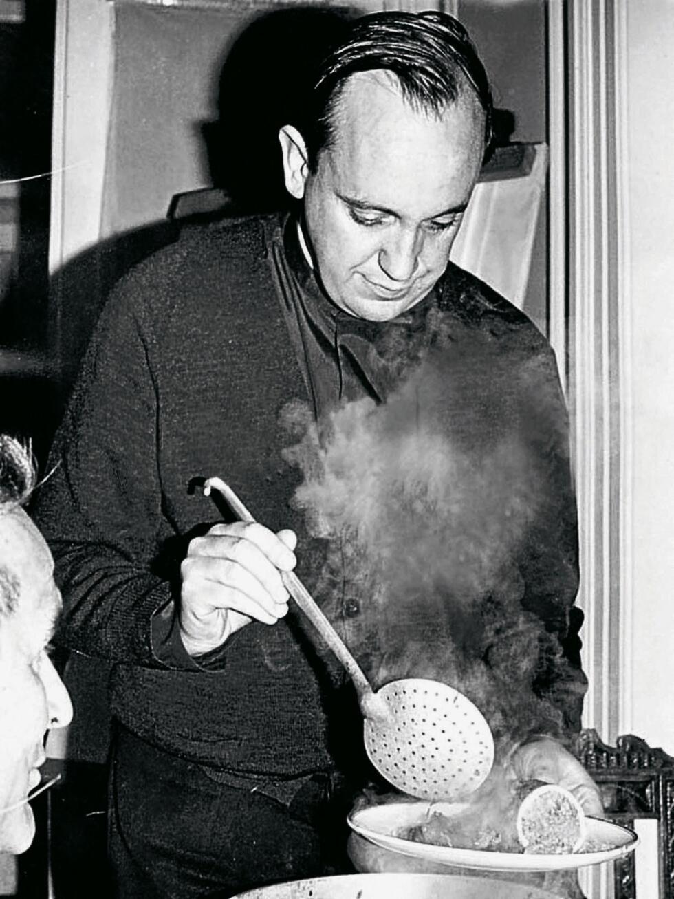 Undated handout picture released by his family of Argentine Jorge Bergoglio, now Pope Francis, serving a meal  in Buenos Aires.