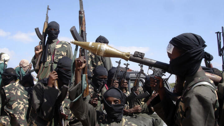 Al Shabaab fighters on pickup trucks prepare to travel into the city, just outside Mogadishu, in Somalia, in this file photo from 2008. 