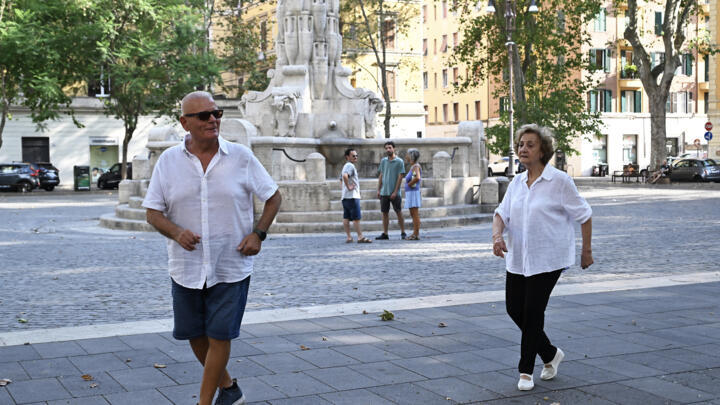 Two seniors dancing in a square during the heatwave in Rome have become a viral sensation