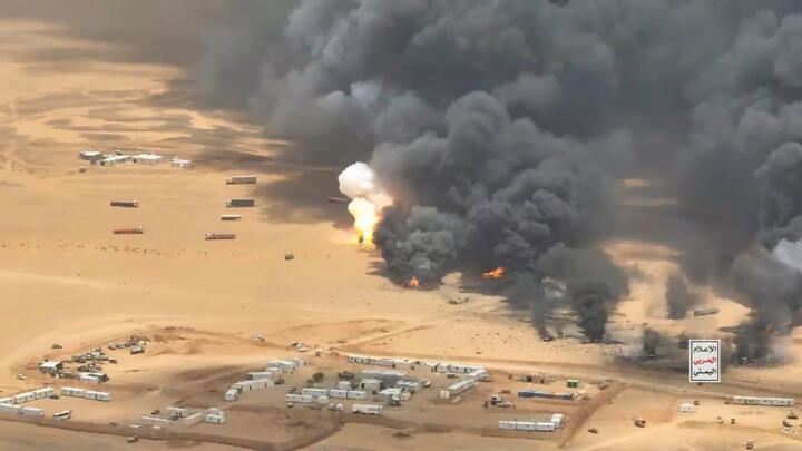 This image released by Houthi forces purportedly shows a ballistic missile strike on trucks carrying military equipment from Saudi Arabia to Yemen.
