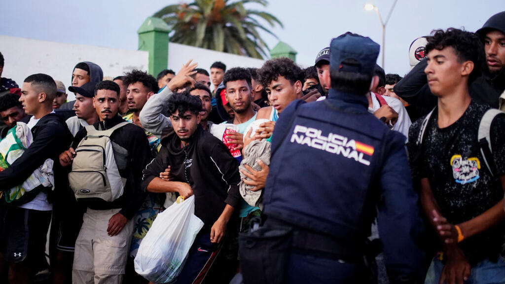 Hundreds of migrants clash with police after crossing from Morocco to Ceuta, Spain, September 13, 2026.