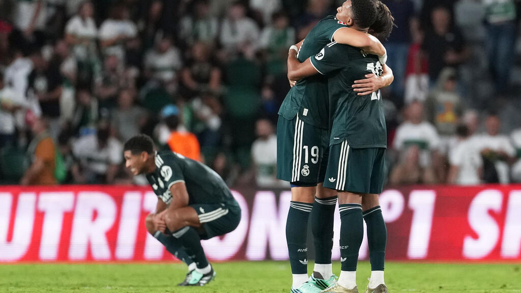 Real Madrid's Carlos Espi celebrates with Real Madrid's Kylian Mbappe, right, after the Spanish La Liga soccer match between Elche and Real Madrid in Elche, Spain on September 15, 2026.