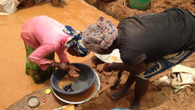 Gold miners work at a mining site in the Cameroon town of Betare Oya.