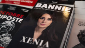 This photograph shows the book of Xenia Fedorova (C), the former director of the French version of Russian state-run foreign language channel RT which was banned in France after the Russian invasion o