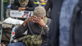 A group of 11 South African men allegedly lured to fight alongside Russian soldiers in the war against Ukraine arrive at King Shaka International Airport in Durban on February 25, 2026. 