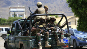 Yemen's Houthi armed forces patrol as Yemeni prisoners loyal to the Houthi authorities arrive in the capital Sanaa on September 12, 2026