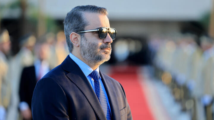 Syrian Foreign Minister Asaad al-Shaibani waits for the arrival of French President Emmanuel Macron at the Damascus International Airport on July 6, 2026.