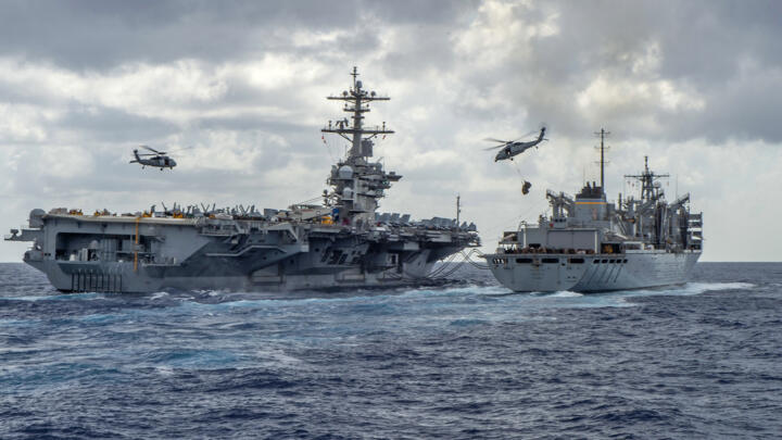 This handout picture released by the US Navy on May 8, 2019 shows the Nimitz-class aircraft carrier USS Abraham Lincoln (CVN 72) while conducting a replenishment-at-sea