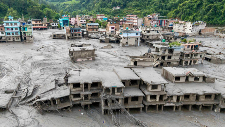 An aerial view showing houses buried under mud following flash floods in Devighat, in the municipality of Bidur, Nuwakot District, Nepal, on August 27, 2026