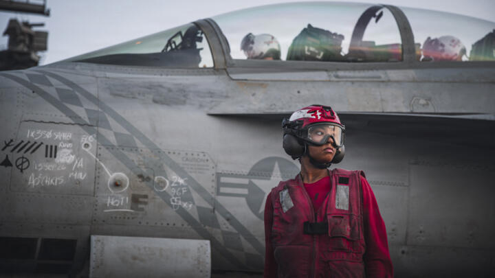 This handout picture released by the US Navy on September 13, 2026, shows a sailor after checking ordnance on an F/A-18 Super Hornet on the flight deck of aircraft carrier USS George Washington.