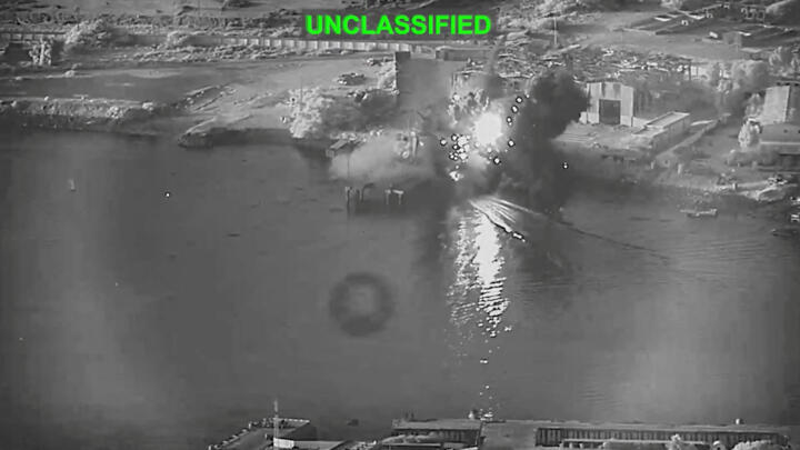 Smoke rises after a US one-way attack surface drone reached its target, a submarine and ship maintenance facility in Bandar Abbas.