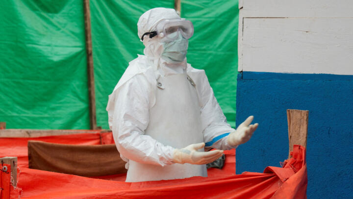 A medical worker dressed in personal protective equipment walks within the emergency unit at the Katwa Ebola treatment center, in the North Kivu province, DR Congo, on September 10, 2026.