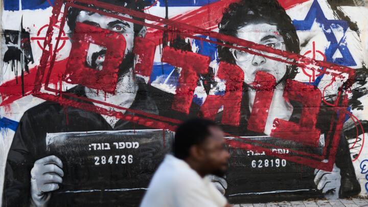 Graffiti showing directors Rachel Szor and Yuval Abraham, winners of the special jury prize for the film 'Naza', with the Hebrew writings "traitors" in Ashdod, Israel, Tuesday, Sept. 15, 2026.