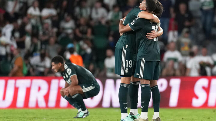 Real Madrid's Carlos Espi celebrates with Real Madrid's Kylian Mbappe, right, after the Spanish La Liga soccer match between Elche and Real Madrid in Elche, Spain on September 15, 2026.