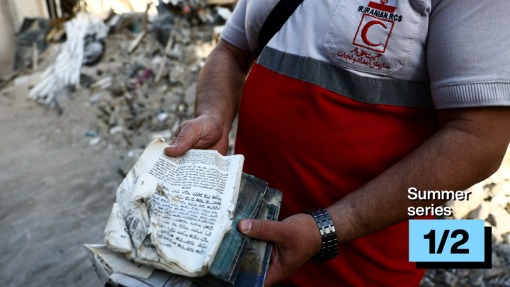 A member of the Iranian Red Crescent holds the Torah at a synagogue which was damaged in a strike amid the US-Israeli conflict, Tehran, Iran, April 7, 2026.