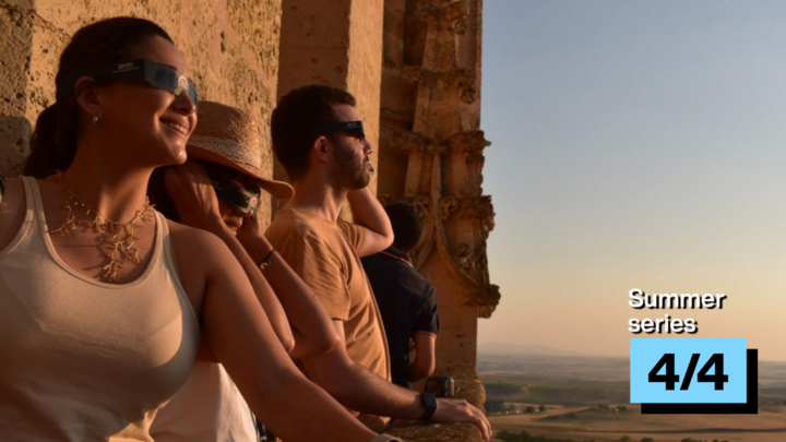 Kelly, Elsa and Yago observe the total solar eclipse from the top of Segovia's cathedral on August 12, 2026